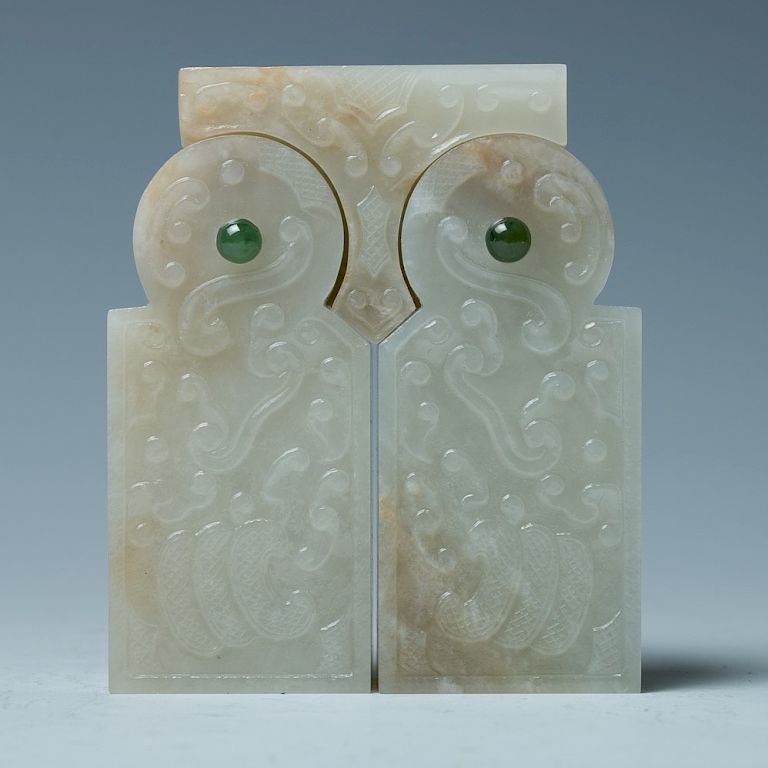 Appraisal: CELADON JADE PLAQUE The pendant of overall rectangular form the