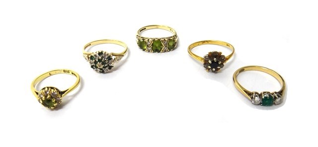 Appraisal: A gold emerald and diamond set three stone ring detailed