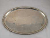 Appraisal: A white metal tests silver oval circular tray with stiffened