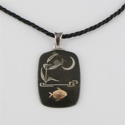 Appraisal: A shakudo style pendant by George Jensen depicting a fish