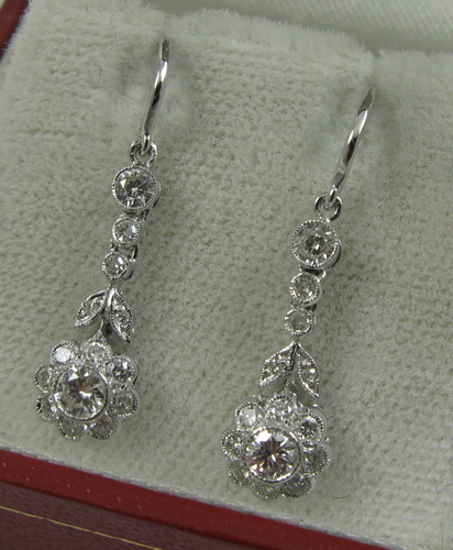 Appraisal: PAIR OF DIAMOND AND EIGHTEEN KARAT GOLD EARRINGS each set