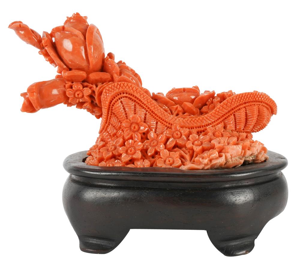 Appraisal: CHINESE CORAL CARVINGdepicting blossoms in a basket Condition affixed to