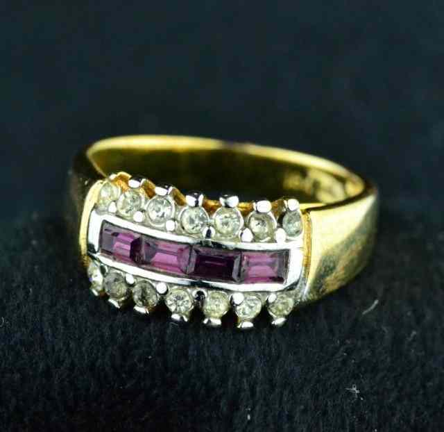 Appraisal: LADIE'S COCKTAIL RINGLovely gold colored ring with red baguettes surround