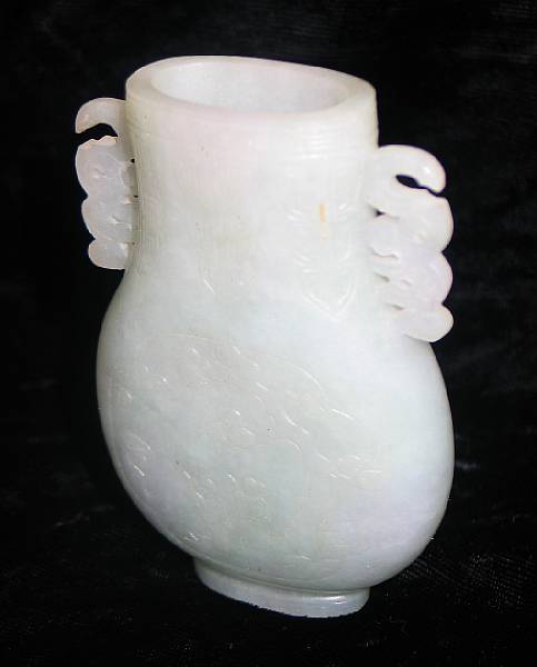 Appraisal: A miniature jadeite vase Of flattened hu form with reticulated