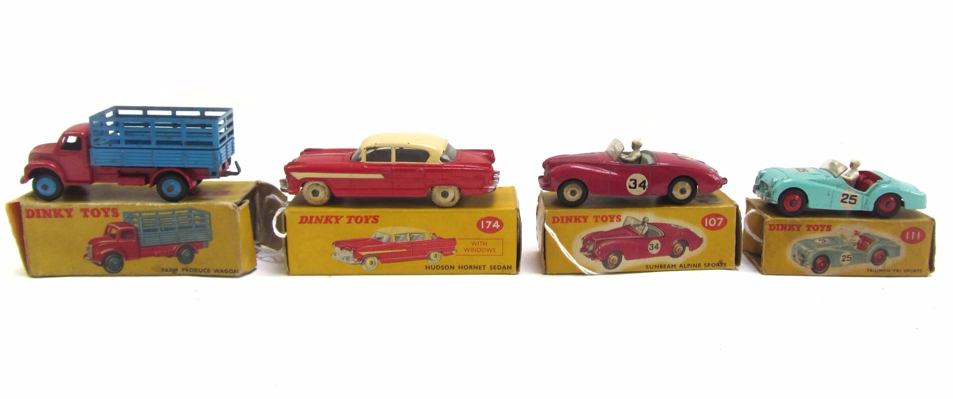 Appraisal: Four Dinky die-cast vehicles comprising farm produce wagon Hudson Hornet