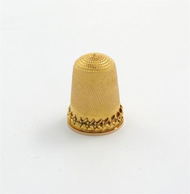 Appraisal: A late th century gold thimble unmarked conventional form with