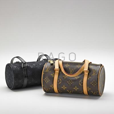 Appraisal: TWO BARREL-SHAPED MINI FASHION HANDBAGS In the style of Louis