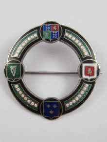 Appraisal: A Norwegian silver circular badge enamelled with various crests Approx