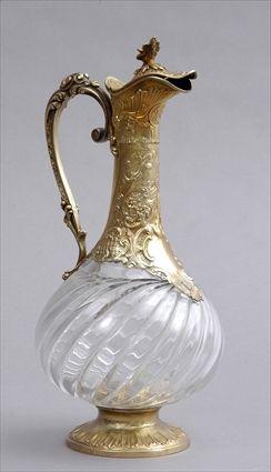 Appraisal: FRENCH SILVER-GILT-MOUNTED GLASS CLARET JUG The spiral reeded pear-form bowl