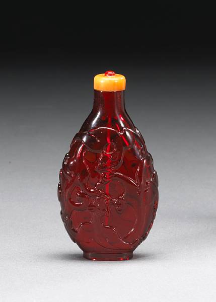 Appraisal: A ruby glass snuff bottle with dragon decoration th Century