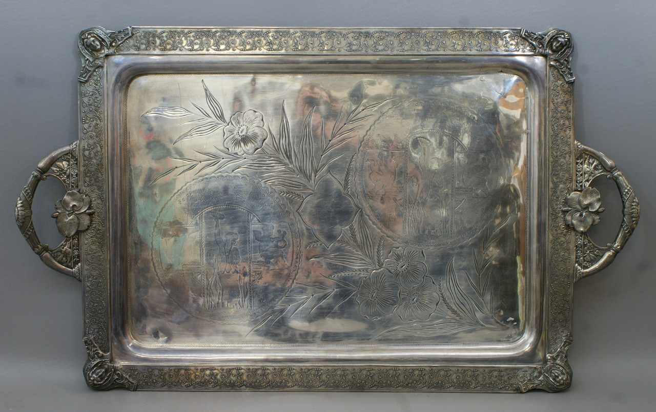 Appraisal: Plated silver Aesthetic style tray ladies heads at each corner