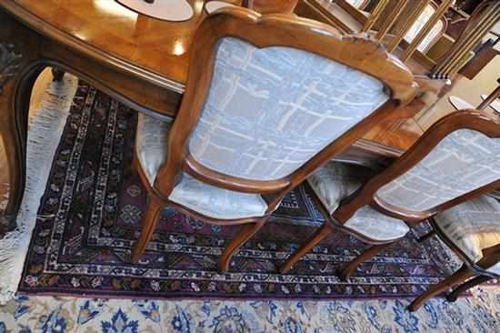 Appraisal: A PERSIAN RUG IN DEEP BLUE MAUVE AND GOLD TONES