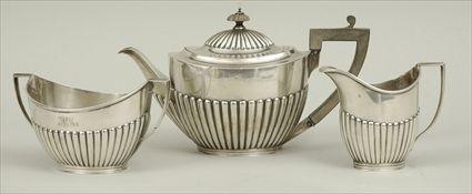 Appraisal: Edwardian Silver Three-Piece Tea Service London and Goldsmiths Silversmiths Company