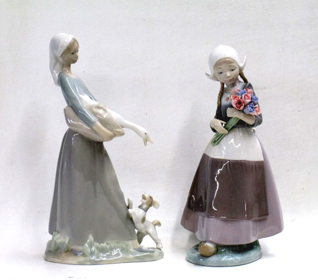 Appraisal: TWO LLADRO PORCELAIN FIGURINES Ingrid Dutch Girl with Tulips sculptor