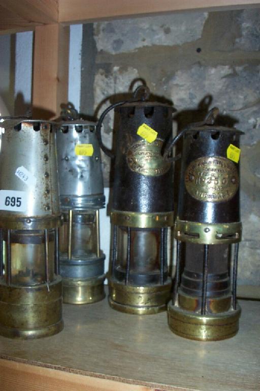 Appraisal: A group of four various miner's lamps including examples by