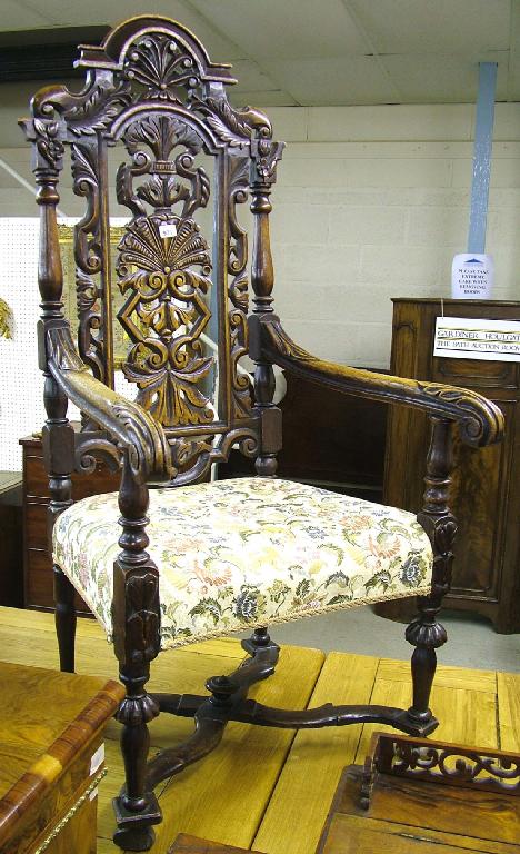 Appraisal: Carolean style carved oak armchair the pierced high back carved