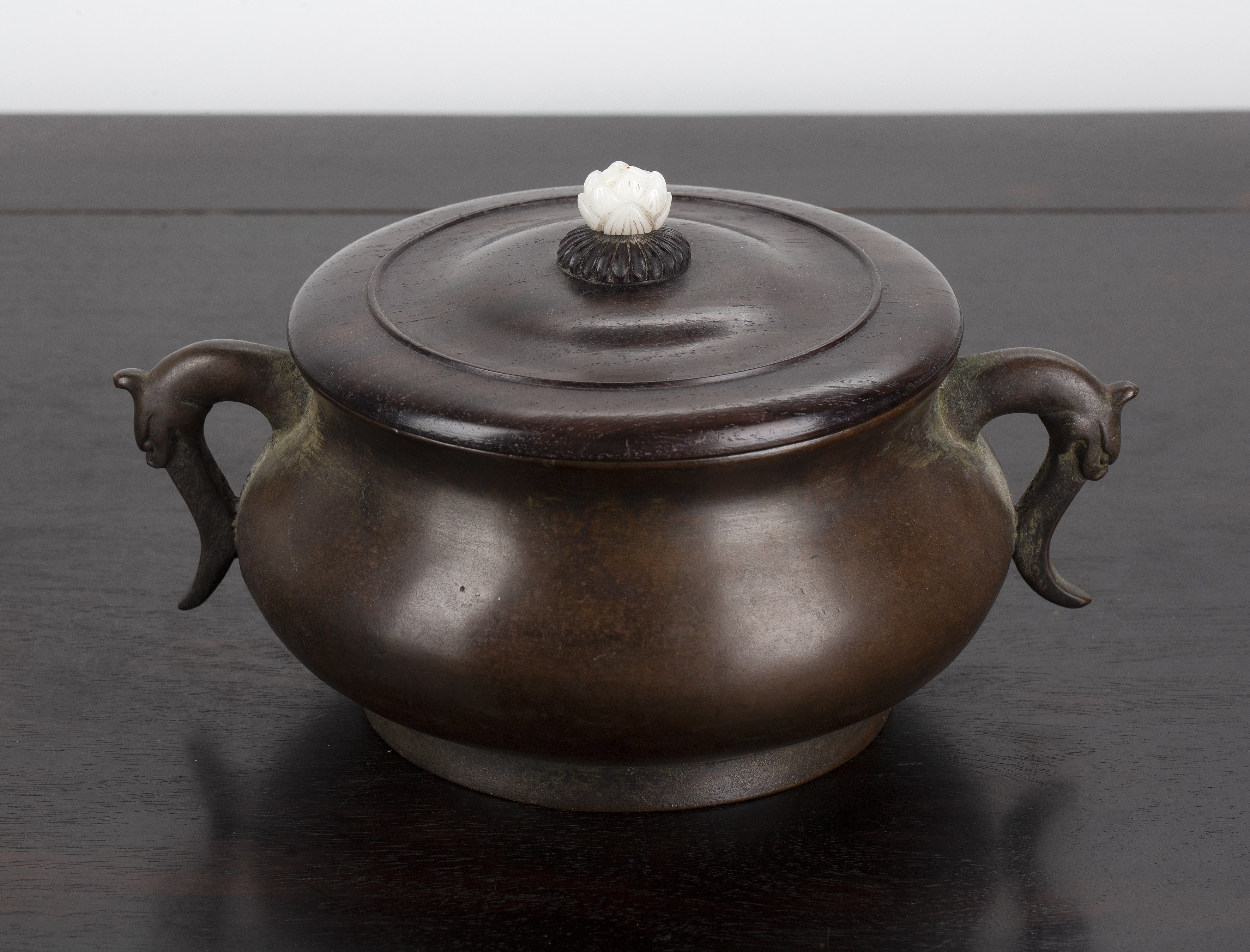 Appraisal: Bronze censer with a wooden lid and jade flower finialChinese