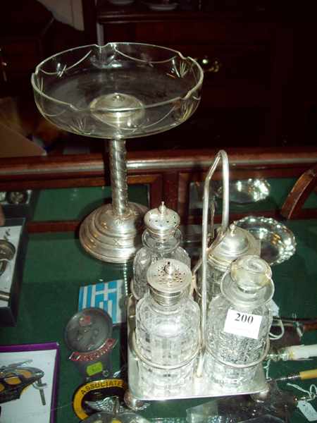 Appraisal: A FOUR BOTTLE CRUET SET AND A CRYSTAL AND PLATED