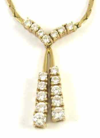 Appraisal: DIAMOND AND FOURTEEN KARAT GOLD NECKLACE set between two equal