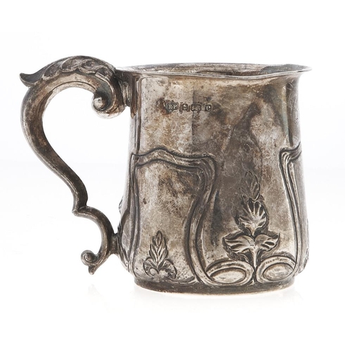 Appraisal: An art nouveau embossed silver christening mug with leaf capped