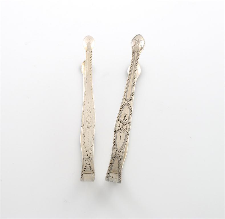 Appraisal: A pair of George III silver bright-cut sugar tongs