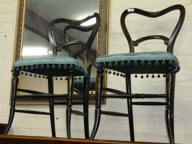 Appraisal: A PAIR OF VICTORIAN BLACK LACQUERED HOOP BACK OCCASIONAL CHAIRS