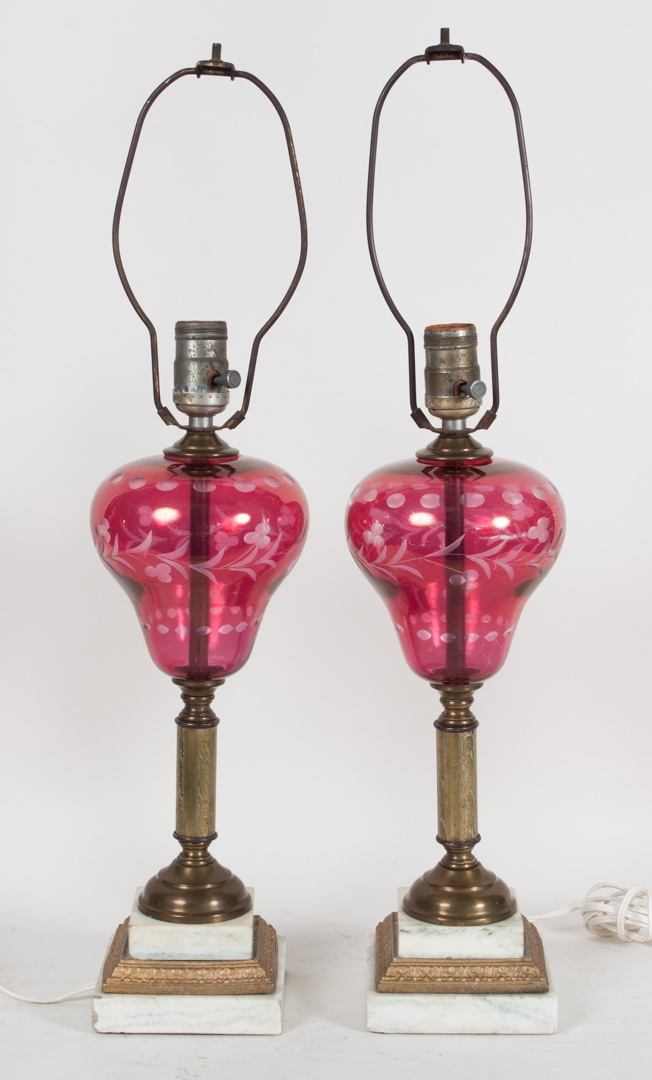 Appraisal: Pair of ruby glass brass and marble oil lamps second