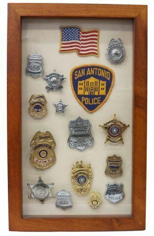 Appraisal: Framed collection of Texas police and firemen's badges displayed in