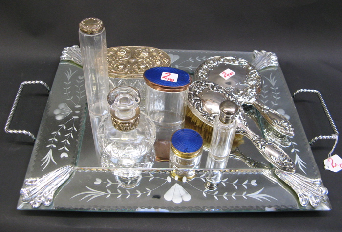 Appraisal: AN ENGRAVED MIRROR TOP DRESSING TRAY footed with handles displaying