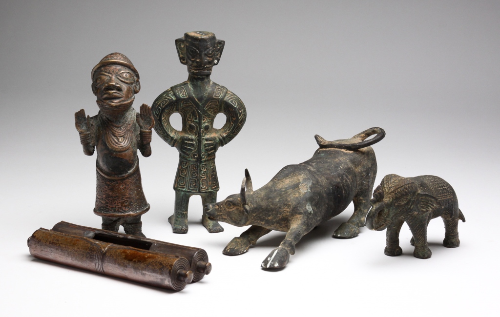 Appraisal: Asia and Africa th century bronze and copper Two standing