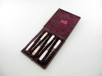 Appraisal: A Victorian cased set of plated nut picks with carved