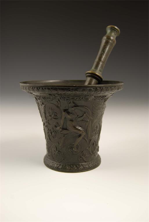 Appraisal: A cast bronze mortar of flared form