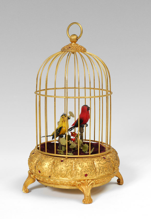 Appraisal: GERMAN BIRD AUTOMATON birds in a gilt cage with applied