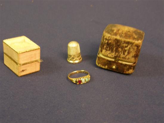 Appraisal: Gold ring set with five stones and a silver thimble