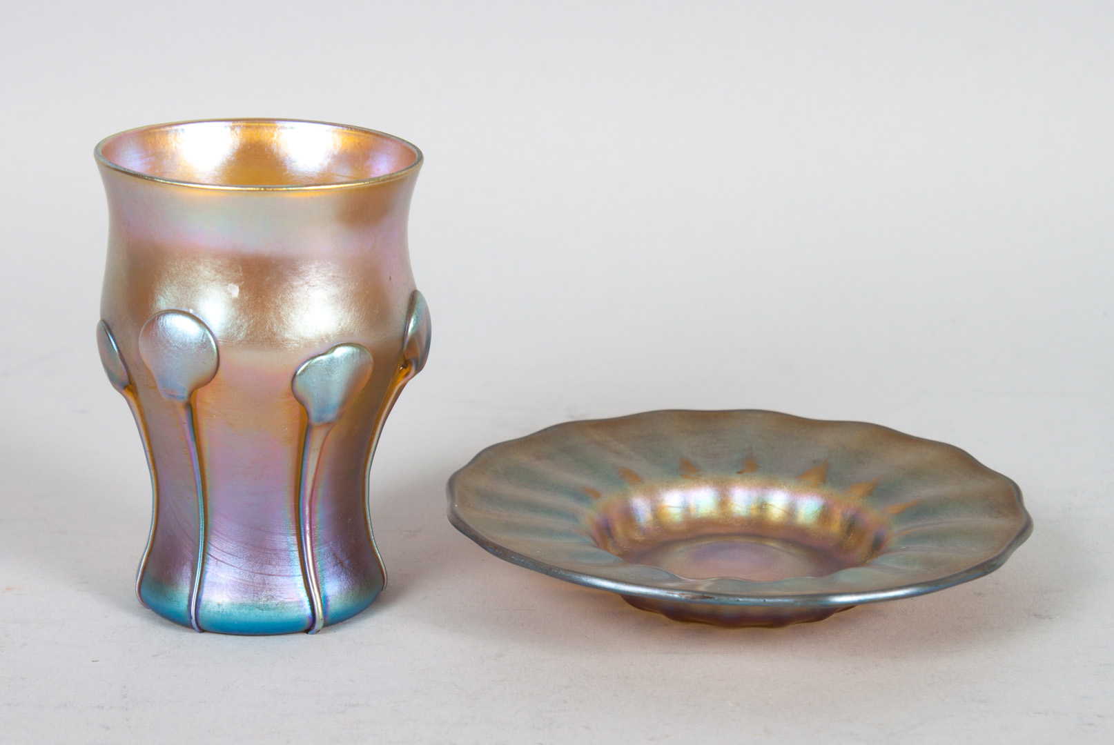 Appraisal: Tiffany Nash glass cup and saucer Tiffany favrile cordial cup