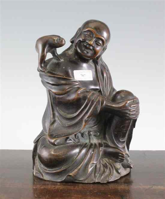 Appraisal: A Chinese bronze seated figure of Liu Hai and his