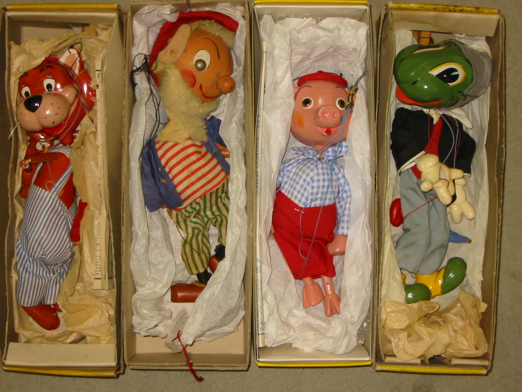 Appraisal: Four Pelham puppets comprising Jiminy Cricket SS Pinky Pig Mr