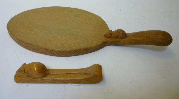 Appraisal: AN ADZED OAK CHEESEBOARD by Robert Mouseman Thompson of oval