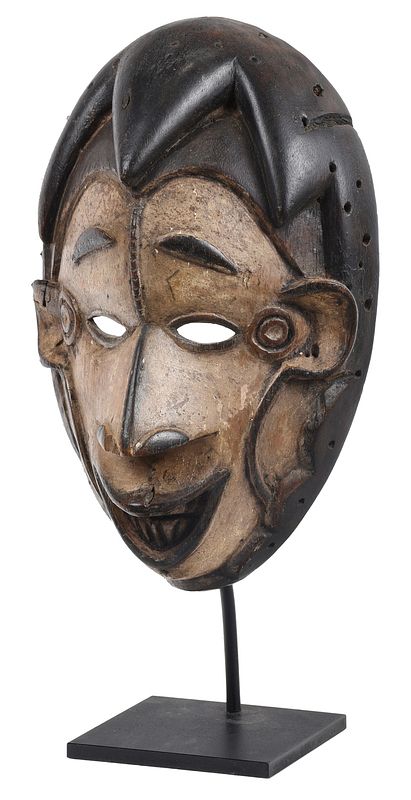 Appraisal: Ibibio Carved Wood Mask Nigeria bi colored ovoid mask with