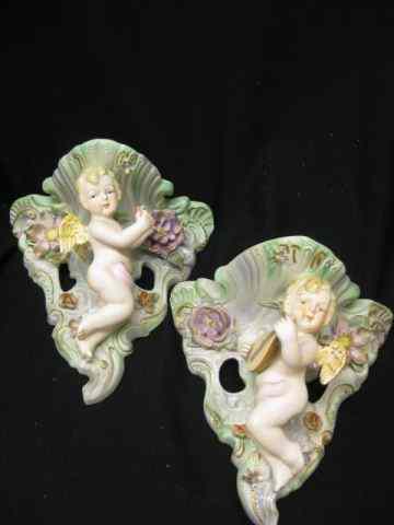 Appraisal: Pair of Occupied Japan Figural Wall Sconces cherub decor signed