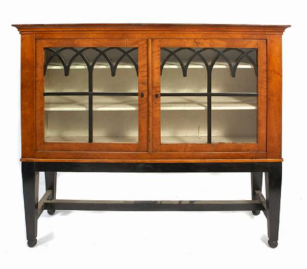 Appraisal: A Biedermeier glazed front cabinet on associated stand height ft