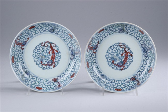 Appraisal: PAIR CHINESE DOUCAI PORCELAIN SHALLOW BOWLS Kangxi period Qilin and