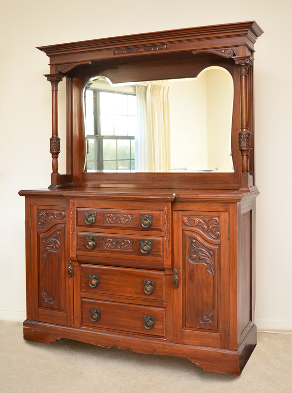 Appraisal: CARVED VICTORIAN SIDEBOARD Stepped pediment with carved panel back with