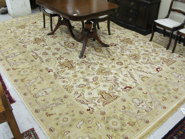 Appraisal: HAND KNOTTED ORIENTAL WOOL CARPET Indo-Persian overall floral design in