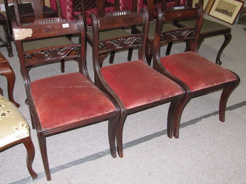 Appraisal: Set of three Regency style mahogany dining chairs with sabre