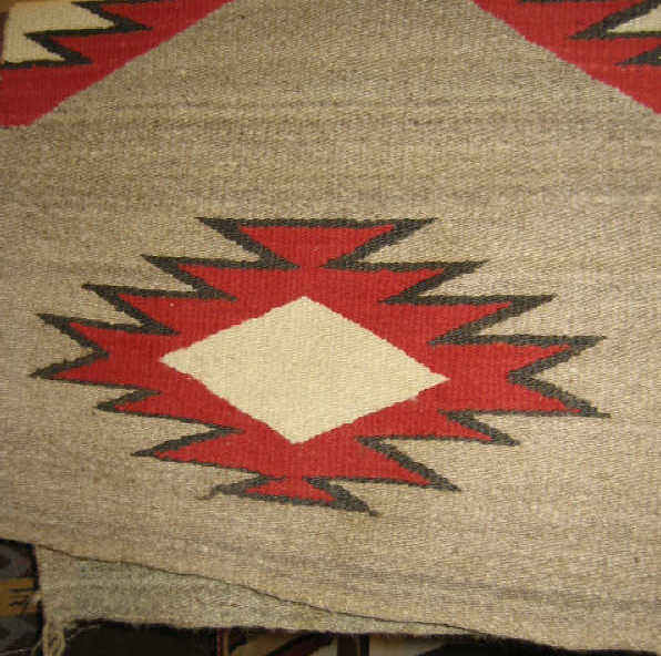 Appraisal: NAVAJO WALL HANGING Natural tan field and sawtooth geometric design