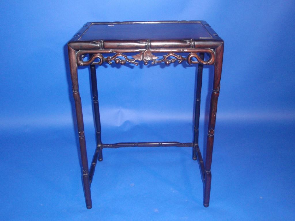 Appraisal: A Chinese rosewood occasional table