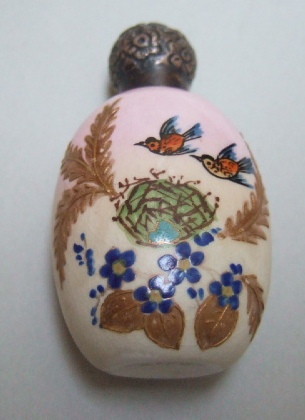 Appraisal: A Victorian silver topped ceramic scent bottle of oval form