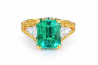 Appraisal: A Diamond and Emerald Gold and Platinum Ring Set with