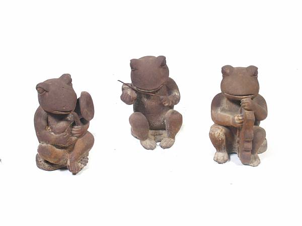 Appraisal: A set of three cast iron frog musicians height in